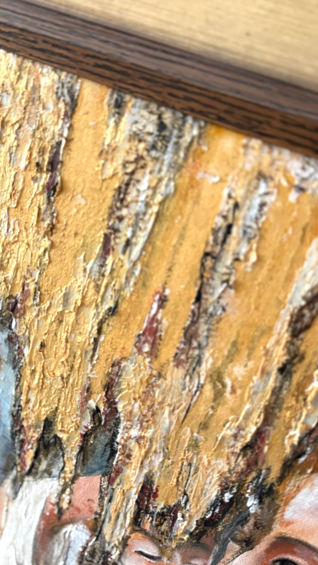 Close-up of gold textured painting surface with rich layered details and warm luminous tones, contemporary European artwork