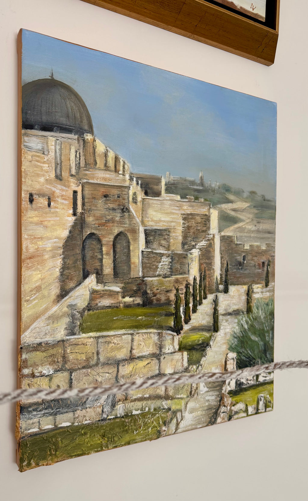 Jerusalem textured painting displayed on wall in interior setting